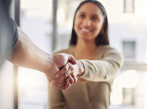 woman shaking hands with someone